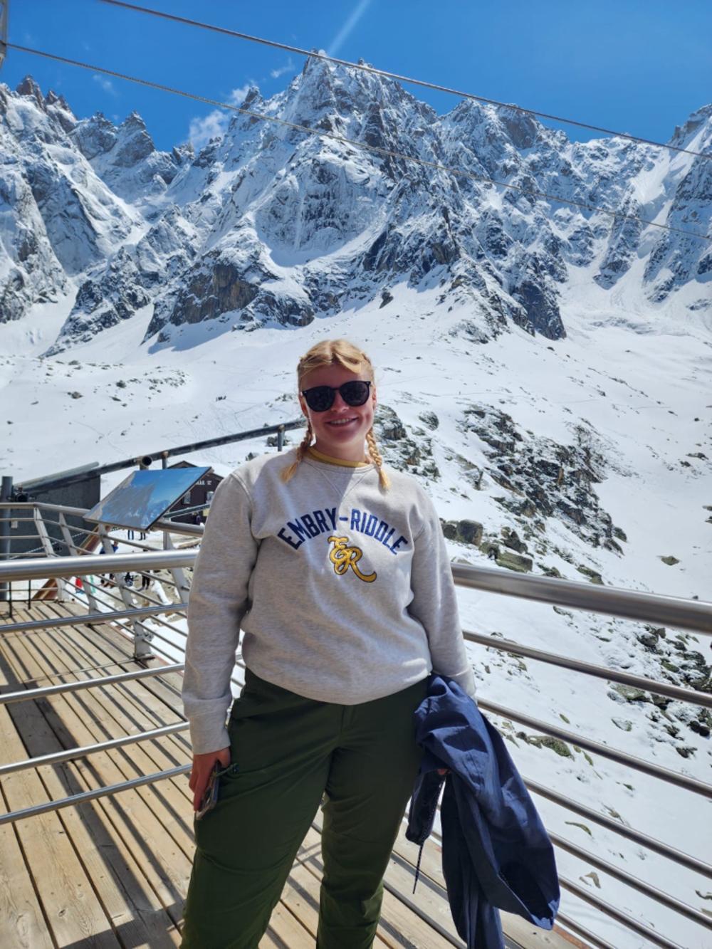 Student and Snowy mountains