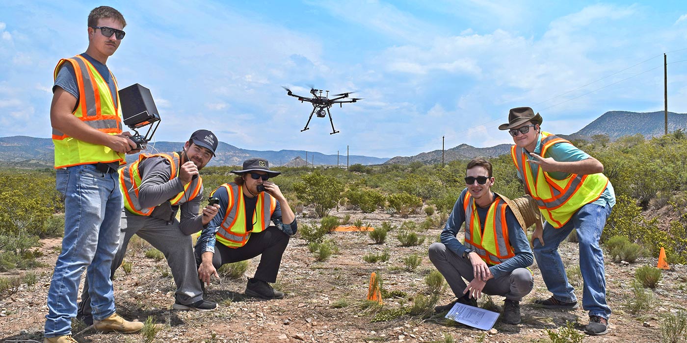 Embry-Riddle students operate small unmanned aircraft system in remote location.